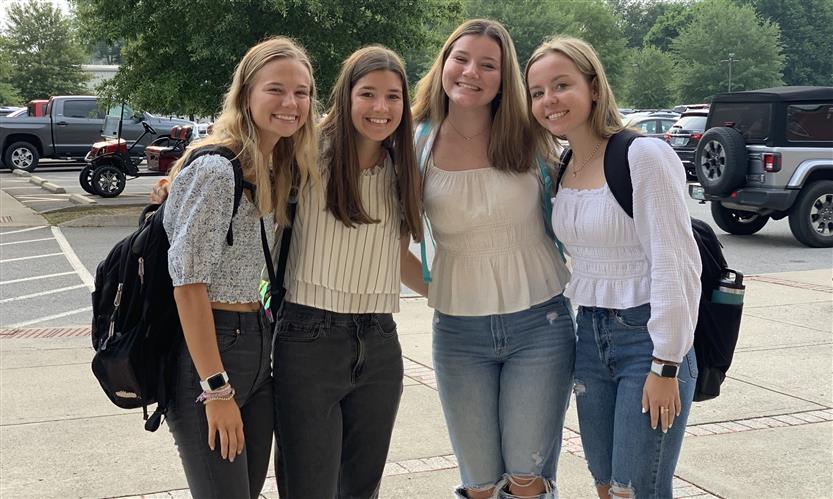 A group of students takes a photo